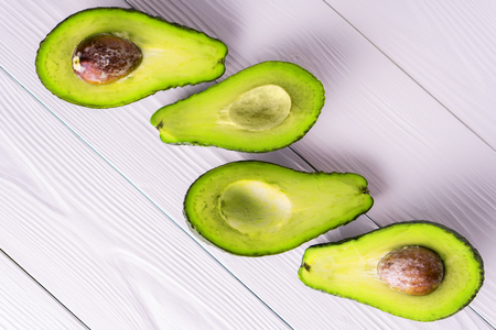 Ripe avocado, with copy space, top view, flat lay. Healthy food concept.