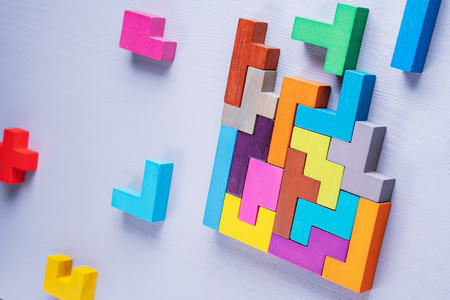 The concept of logical thinking. Geometric shapes on a wooden background.の写真素材