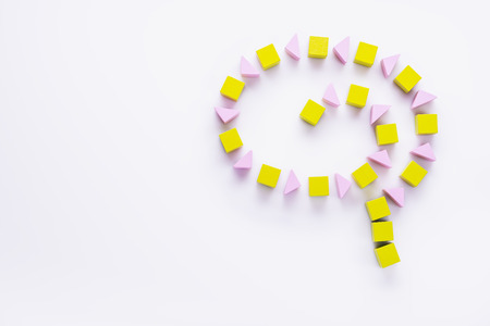Human brain is made of multi-colored wooden blocks on white background.