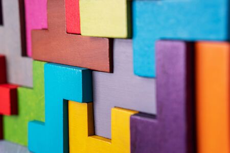 The concept of logical thinking. Geometric shapes on a wooden background.