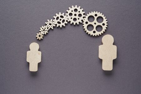 Concept of teamwork, gear system. The concept of functioning, people pieces of company mechanism.