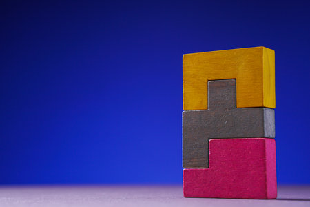 Abstract construction from wooden blocks. The concept of logical thinking, geometric shapes.