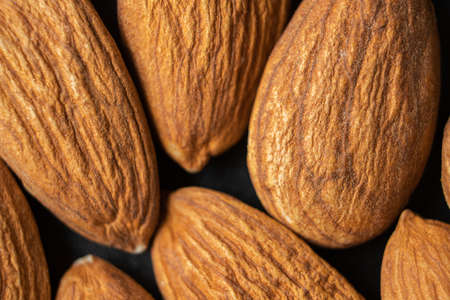 Almond nuts, close up. Almonds background.の写真素材