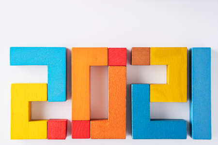 2021 from wooden colored blocks. Expectation of 2021, uncertainty of the course of events in the future. Top view.の写真素材