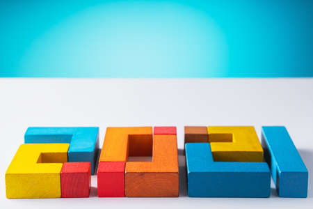 2021 from wooden colored blocks. Expectation of 2021, uncertainty of the course of events in the future.の写真素材