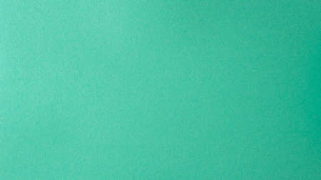 Turquoise kraft paper texture. Empty green colored paper background.の写真素材
