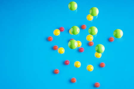 Colorful glossy balls flowing upwards on blue background. Abstract background with bright balls.の写真素材