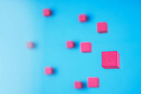 Pink cubes on light blue background.の写真素材