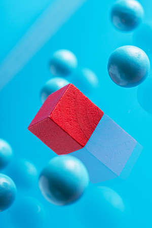 Red box and blue spheres, abstract background.の写真素材