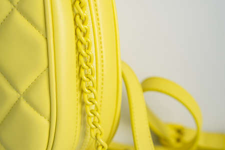 Fragment accessories of an yellow quilted bagの写真素材