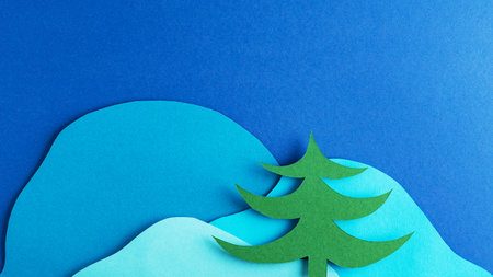 Fir tree on the background of snowy mountains. paper art. Mock upの写真素材