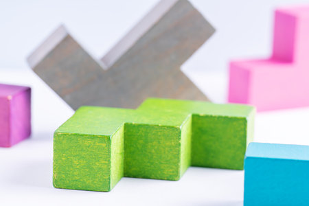 Concept of creative, logical thinking. Different colorful shapes wooden blocks on white background. Geometric shapes in different colors. Abstract Background.の写真素材