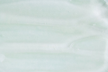 Light green transparent cosmetic gel for skin, aloe vera gel sample with bubbles. Hand sanitizer, alcohol gel blob. Cosmetic background. Transparent cream swirl, close upの写真素材