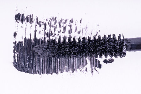 Black mascara brush stroke, macro. Mascara brush and black brush stroke, cosmetic object, beauty concept.の写真素材