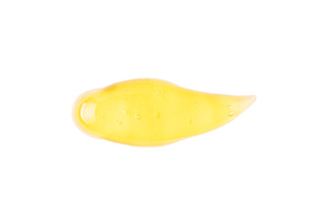 Transparent yellow cosmetic sample texture with bubbles. Cosmetic peeling gel. Cosmetic gel swatch.の写真素材