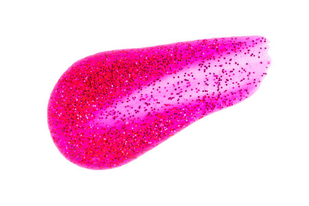 Swatch of dark pink shimmer lip gloss, nail polish, cosmetics product or paint isolated on white background. Deep red glitter swatch of lip gloss, cosmetic product stroke or paint.の写真素材