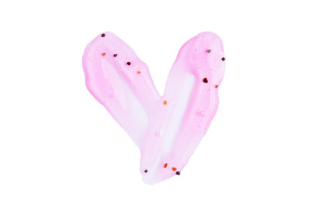 Transparent pink cosmetic sample texture in heart shape with bubbles. Cosmetic peeling gel with raspberry. Cosmetic rose pink peeling gel, beauty texture backgroundの写真素材