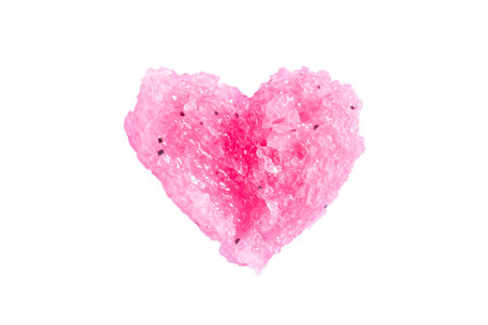 Cosmetic pink scrub in the shape of a heart. Peeling cosmetic sample texture isolated on white background. Flat lay, top view.の写真素材