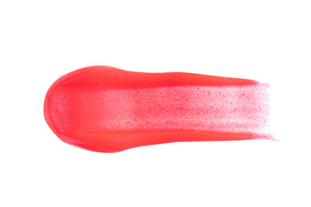 Red shimmer swatch of lip gloss, cosmetic product stroke or paint, macro. Swatches of bright red lipgloss or paint isolated on white background.の写真素材