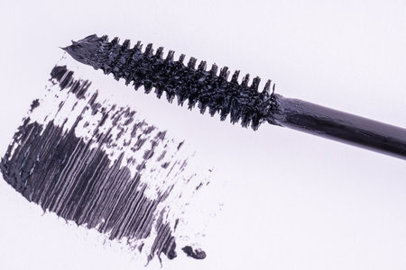 Black mascara brush stroke with applicator brush, fashion beauty concept.の写真素材