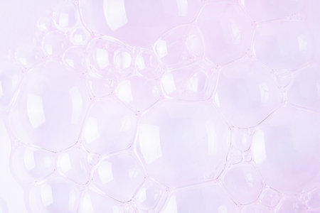 Molecule bubbles in a cosmetic serum, macro background. Clear pink cosmetic gel with molecule bubbles.の写真素材