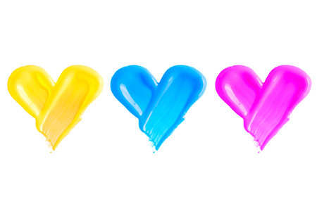 Swatches of colorful nail polish in heart shape isolated on white background. Nail polish sample in yellow, blue and pink color.の写真素材