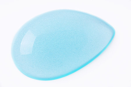 Transparent blue cosmetic sample texture with bubbles. Cosmetic peeling gel. Cosmetic blue peeling gel, beauty texture backgroundの写真素材