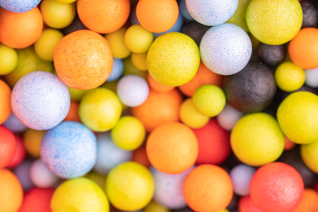 Colorful balls background in red, blue, brown and orange colors. Abstract background with colorful balls in different sizes. Sphere of balls on bright color.の写真素材
