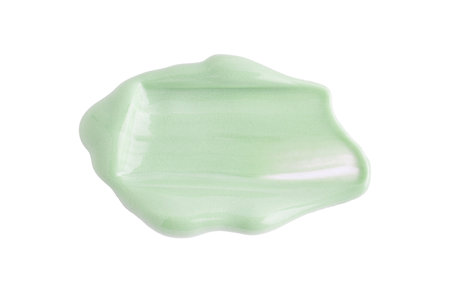 Cosmetic light green cream blob swatch on white background. Pastel green face cream, makeup primer, color correcting cosmetic product, serumの写真素材