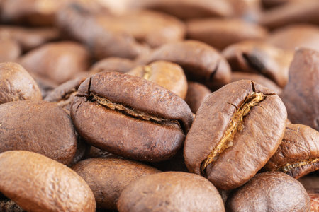 Close up of coffee beans on a wooden background. Fresh coffee beans, macro shotの写真素材