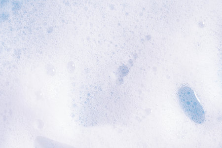 Foam texture background. Soap, shampoo, mousse, shower gel foam, soap suds.の写真素材