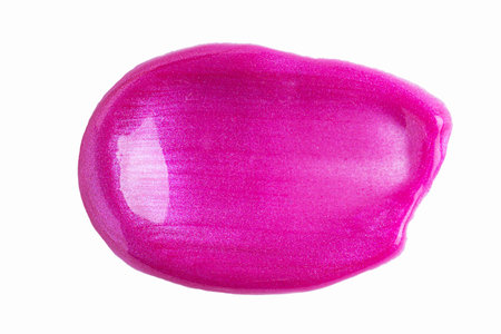 Pink shimmer swatch of lip gloss, cosmetic product stroke or paint, macro. Swatches of purple, violet lipgloss or paint isolated on white background.の写真素材
