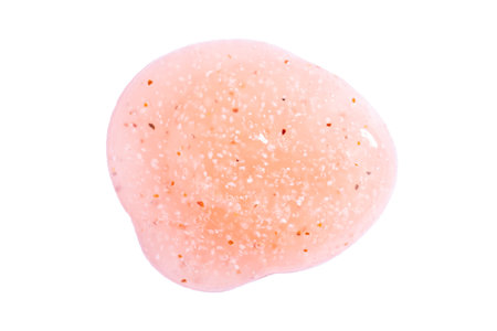 Brush strokes, scrub smear, cosmetics skincare texture swatch, body peeling in peach fuzz color isolated on white. Flat lay, top view.の写真素材