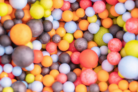 Colorful balls background in red, blue, brown and orange colors. Abstract background with colorful balls in different sizes. Sphere of balls on bright color.の写真素材