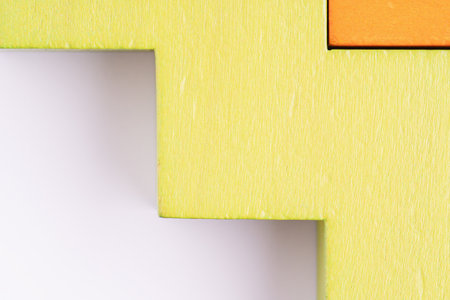Abstract wooden background. Different shapes wooden blocks on white background, macro shotの写真素材