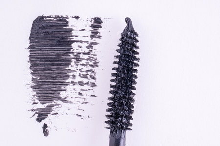 Black mascara brush stroke, macro. Mascara brush and black brush stroke, cosmetic object, beauty concept.の写真素材