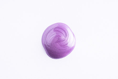 Round swatches of lilac cosmetic smear on white background. Violet beauty smear swipe swatch closeup. Lavender face serum, lotion, moisturizer on white. Light purple paint swatch.の写真素材
