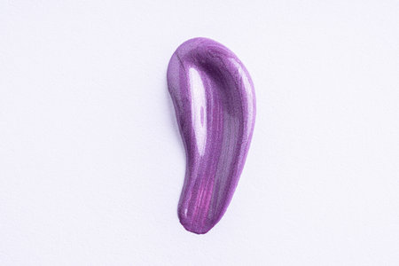 Lilac cosmetic cream smear on white background. Violet beauty cream smear swipe swatch closeup. Lavender face serum, lotion, moisturizer on white. Light purple paint swatch.の写真素材