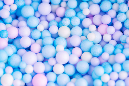 Colorful balls background in pink and blue colors. Abstract background with colorful balls in different sizes. Sphere of balls on pastel color.の写真素材
