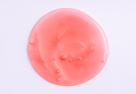 Transparent red cosmetic sample texture with bubbles. Cosmetic shower gel. Cosmetic red face serum, lotion, moisturizer, beauty backgroundの写真素材