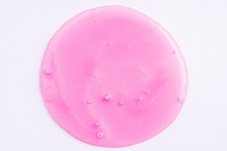 Transparent pink cosmetic sample texture with bubbles. Cosmetic shower gel. Cosmetic rose pink face serum, lotion, moisturizer, beauty backgroundの写真素材