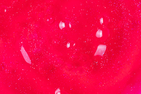 Bright pink cosmetic gel, gel showers sample with bubbles, close up. Cosmetics background.の写真素材