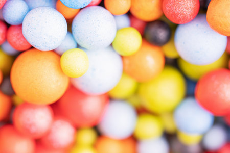 Colorful balls background in red, blue, brown and orange colors. Abstract background with colorful balls in different sizes. Sphere of balls on bright color.の写真素材