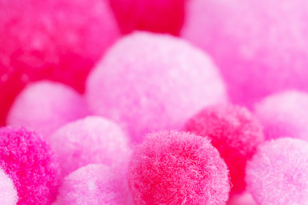 Colorful mini pom poms, pink and white. Heap of small pastel color fluffy ball, macro shotの写真素材