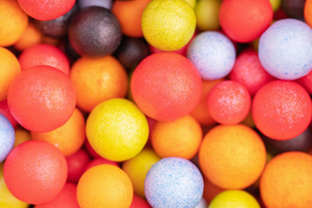 Colorful balls background in red, blue, brown and orange colors. Abstract background with colorful balls in different sizes. Sphere of balls on bright color.の写真素材
