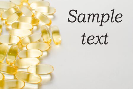 Omega 3 gel capsules on white background, Capsules of fish oil gel の写真素材