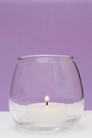 candle isolated on purpleの写真素材