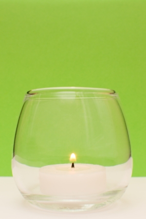 candle isolated on greenの写真素材