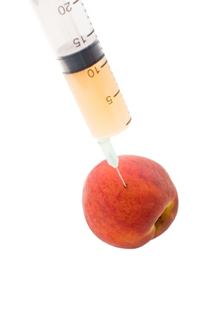 Peach and syringe の写真素材