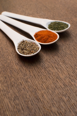 collection of various food ingredients in wooden spoons の写真素材